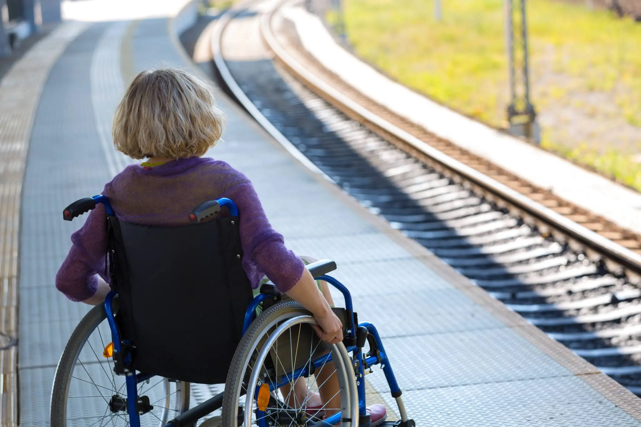 Latest News 28 woman sitting on wheelchair on a platform 1 scaled